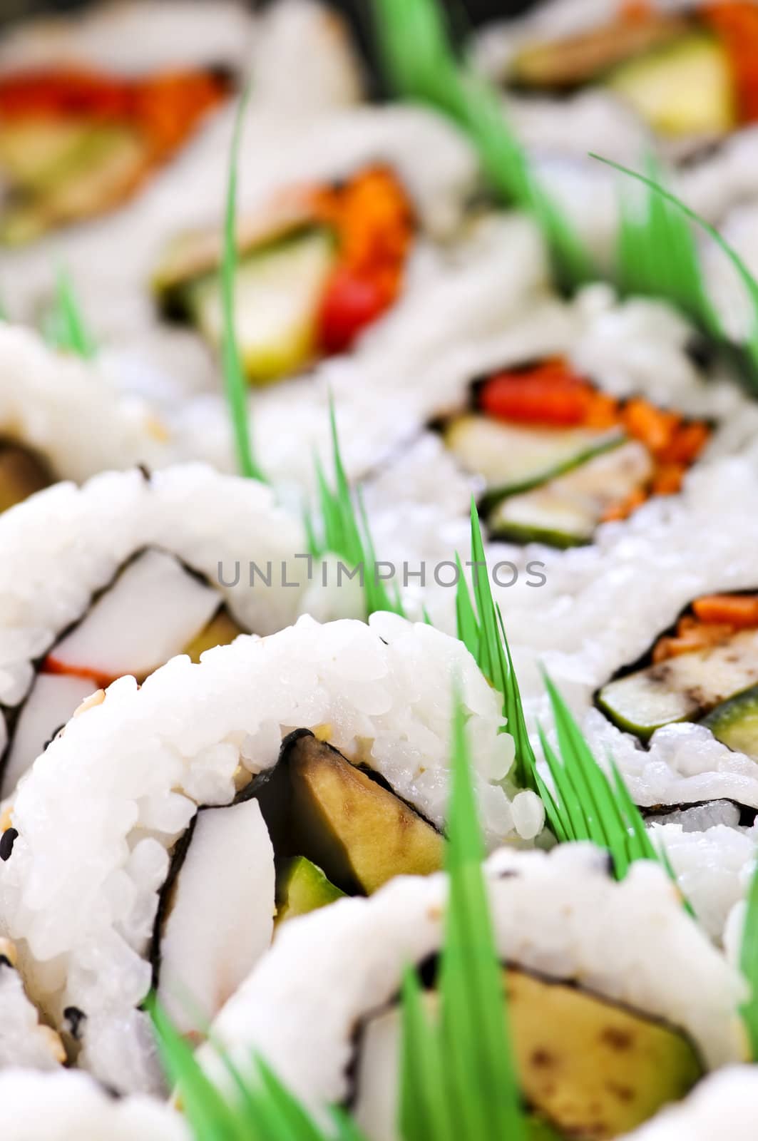 Close up on tray of assorted sushi appetizers