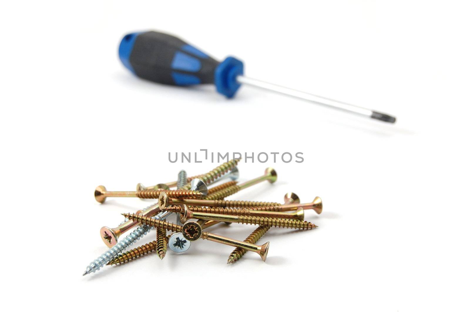 screwdriver and some screws isolated on white background