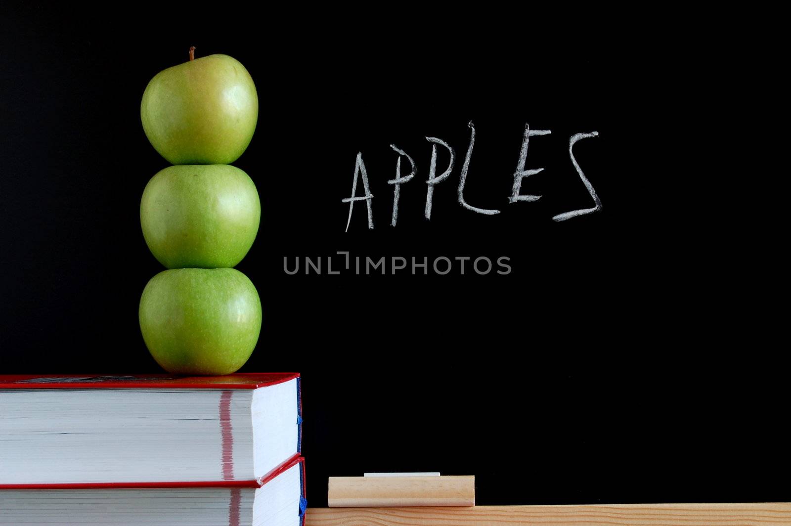 apples books and chalkboard showing healthy lifestyle