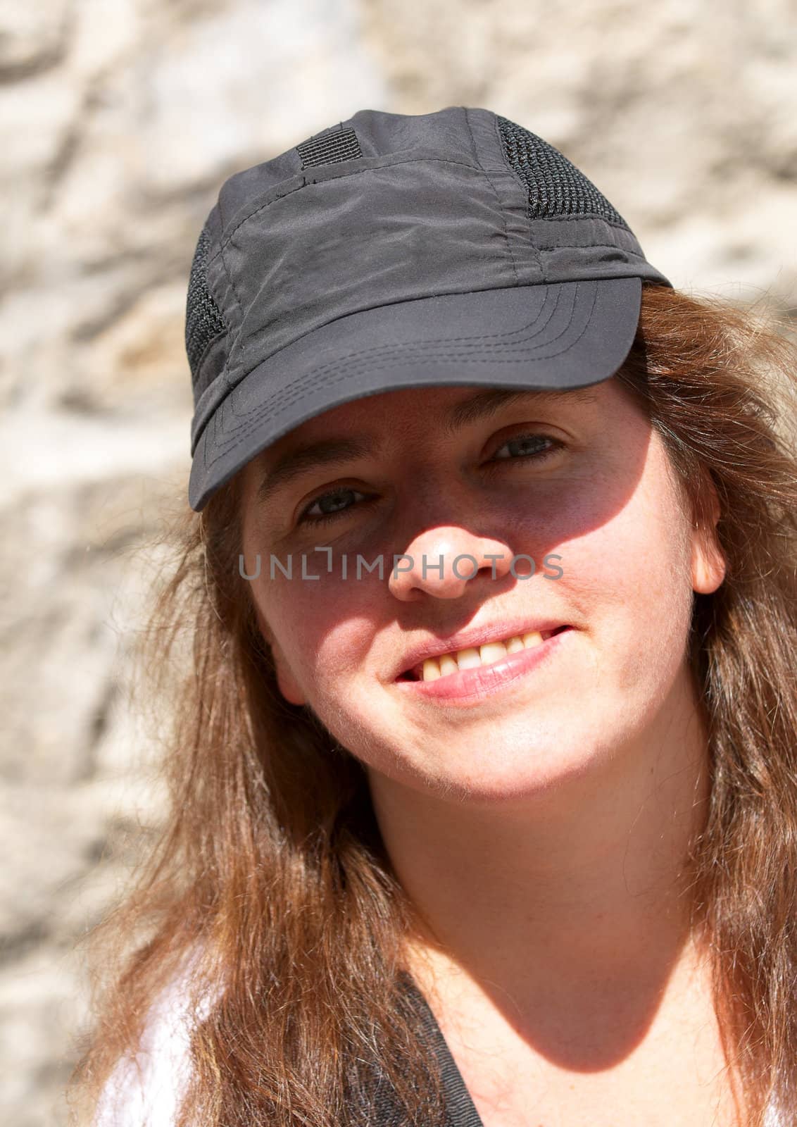 Portrait of a smiling woman. Midday summer.