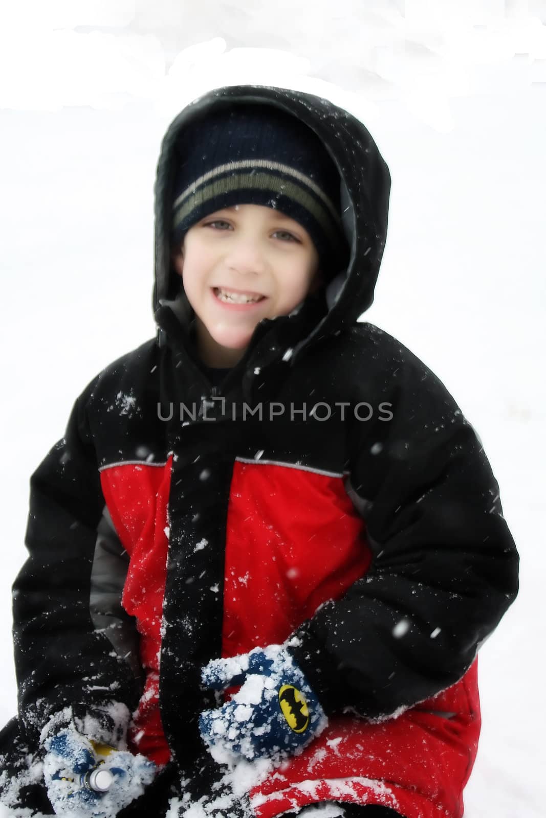 boy in snow by amandaols
