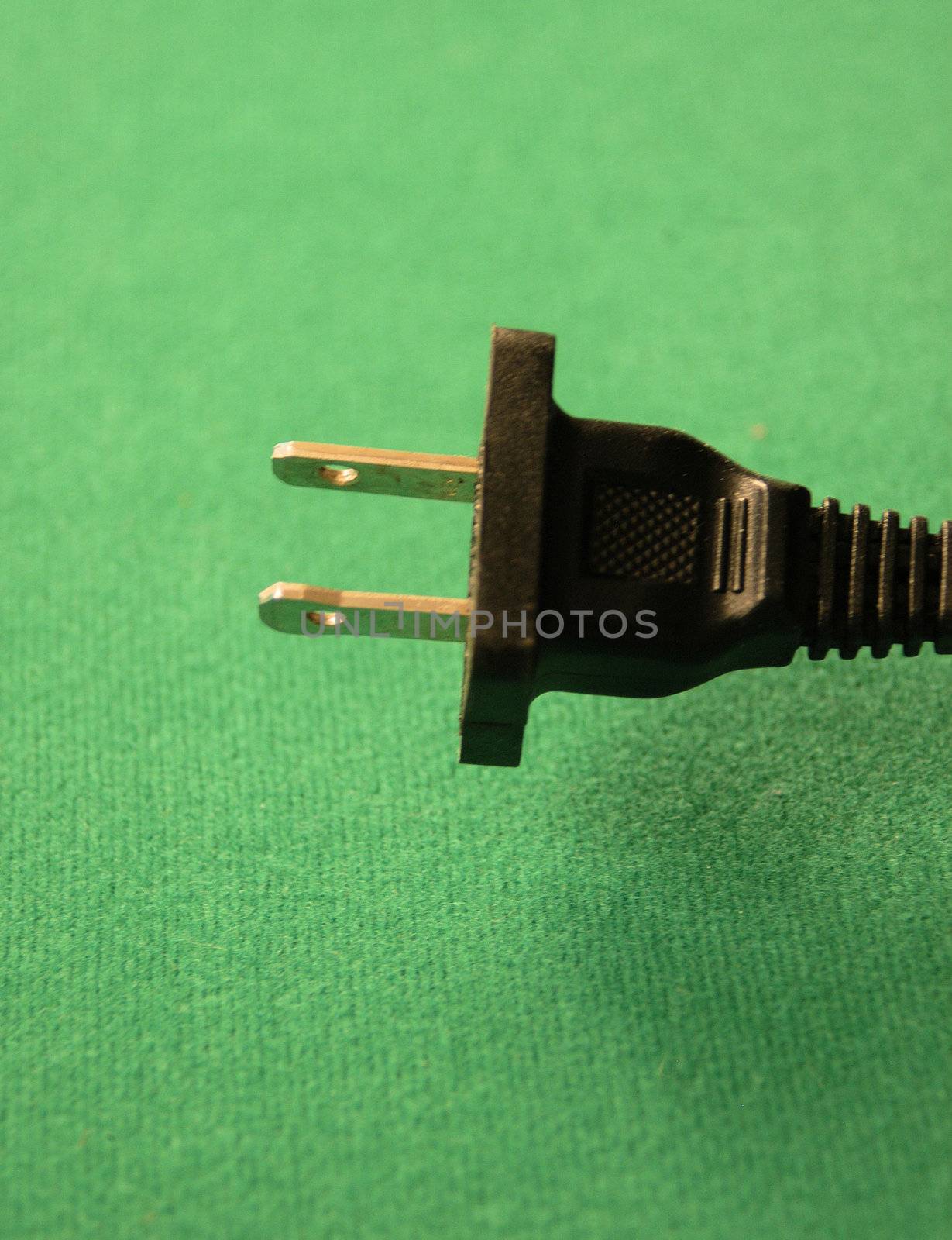 The plug end of an electrical cord