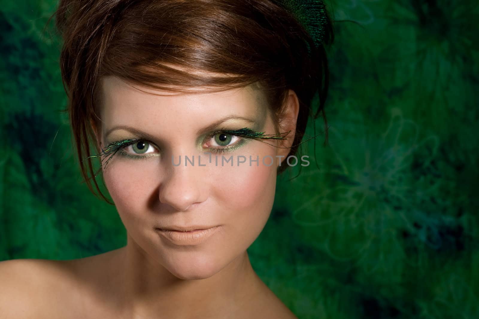 Beautiful girl with long emerald green eyelashes