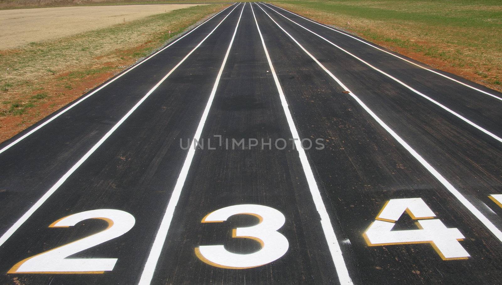 A view of a running track with numbers and lanes