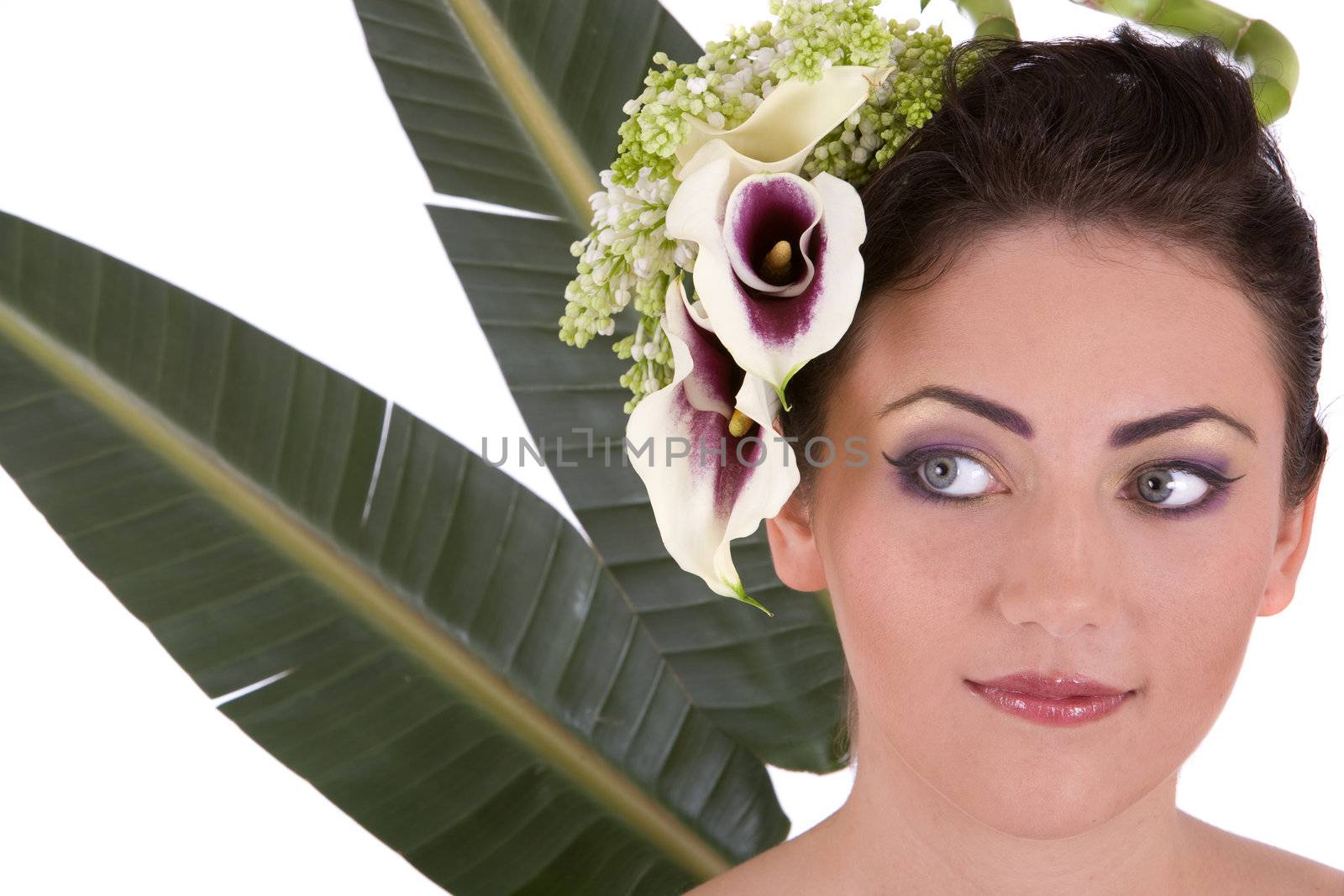 Beautiful woman with tropical flowers in her hair