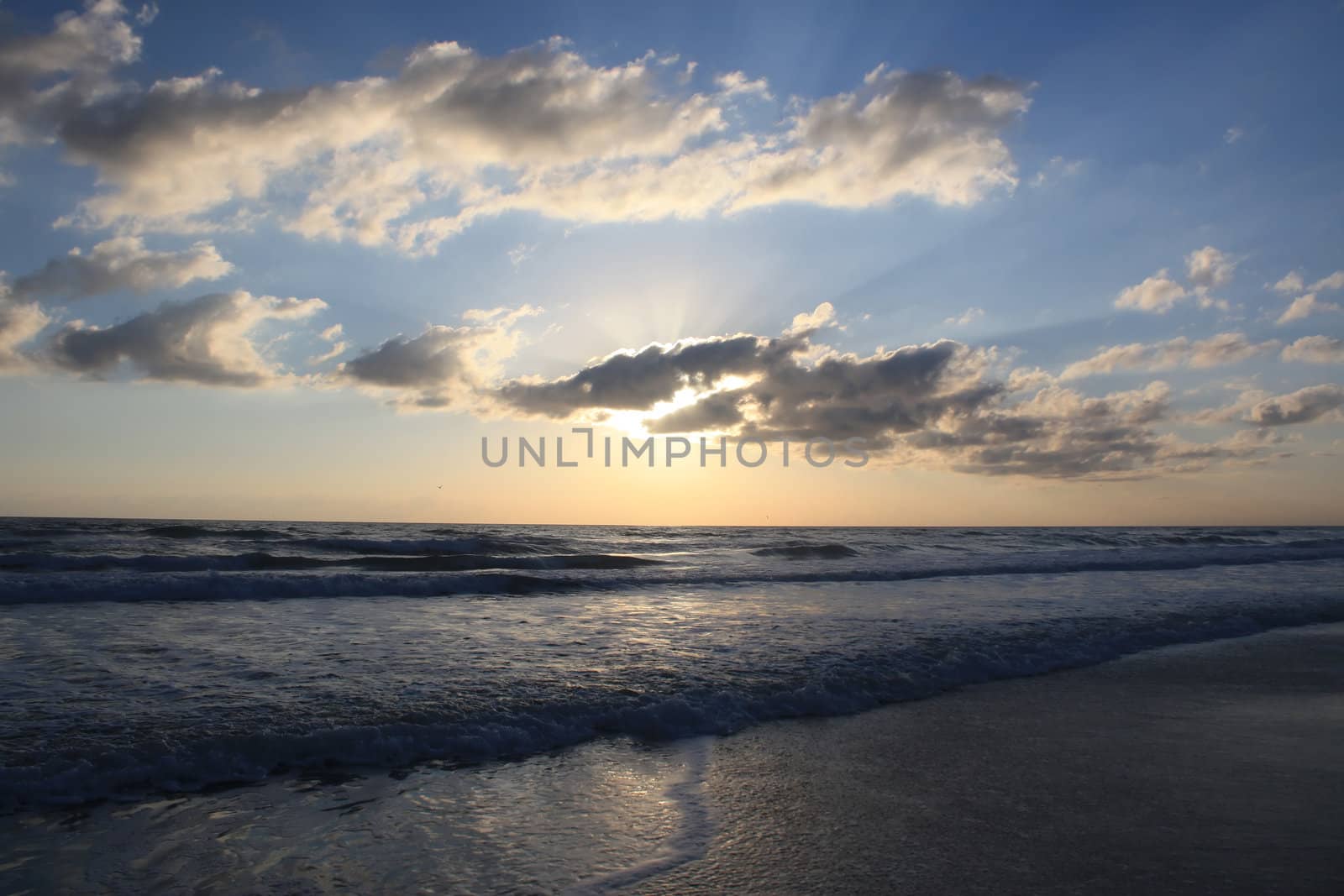 the sun rises over the beautiful atlantic ocean in daytona beach florida