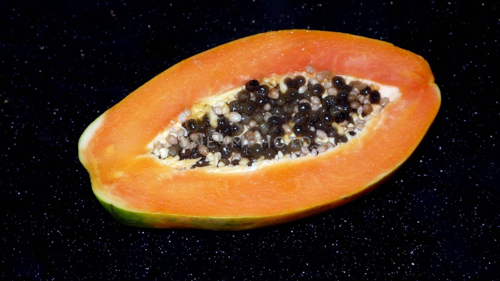 Papaya on a black background