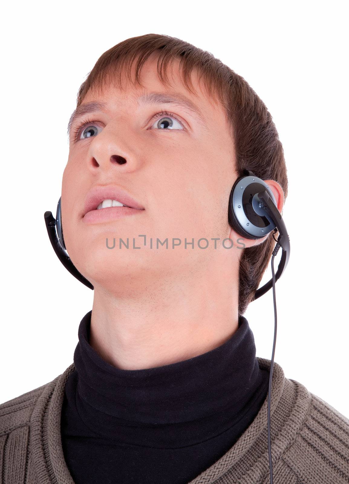 young man  listening to music with headphones