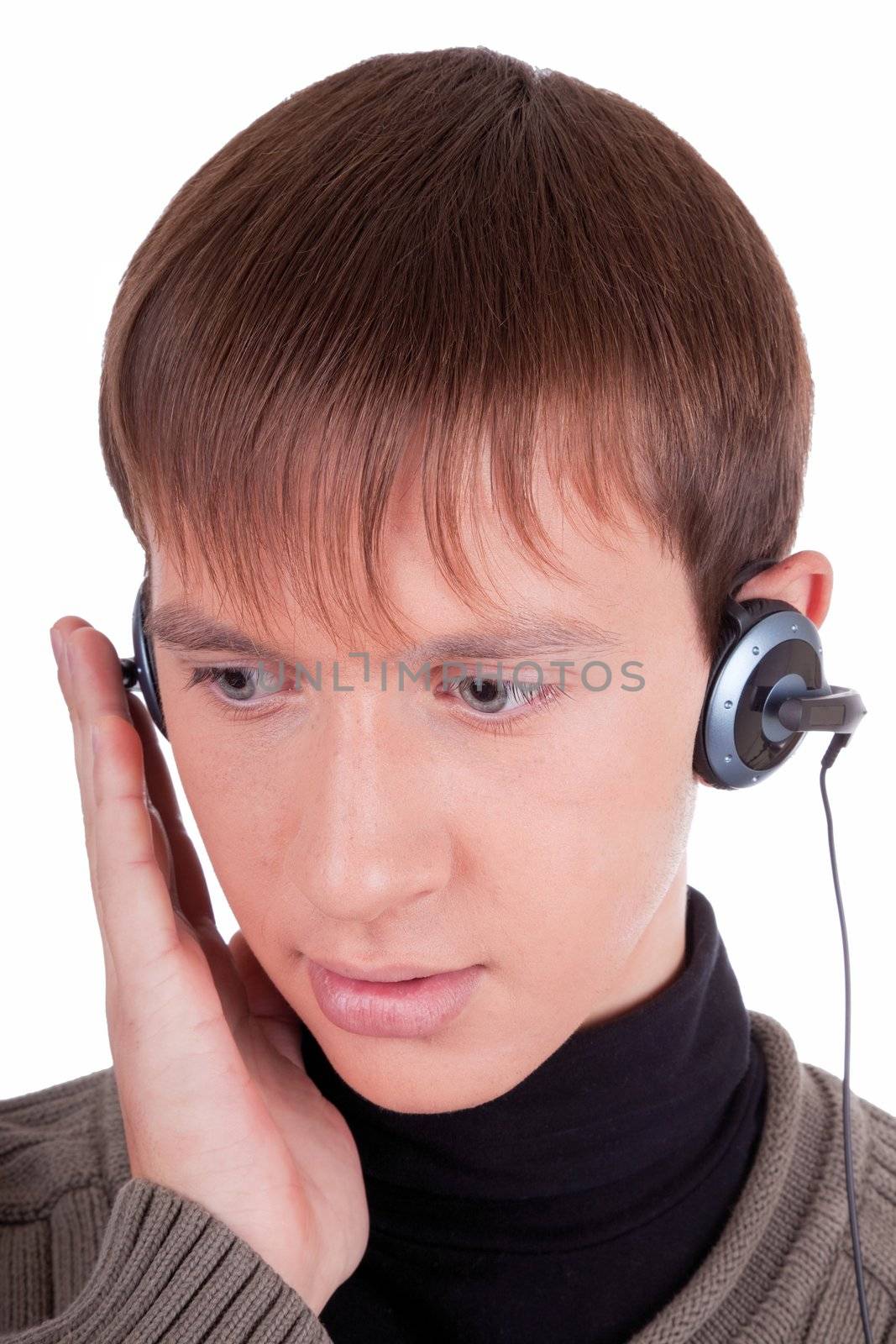 young man  listening to music with headphones