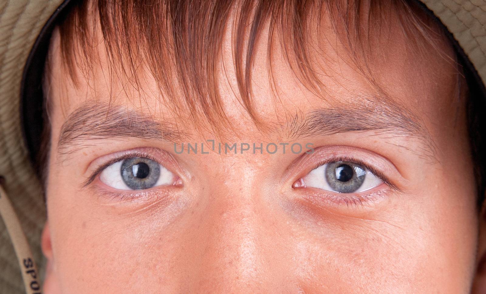 eyes of a young tourist  on white background