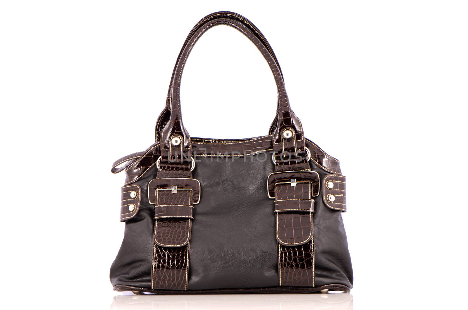Brown woman bag on white reflective background.