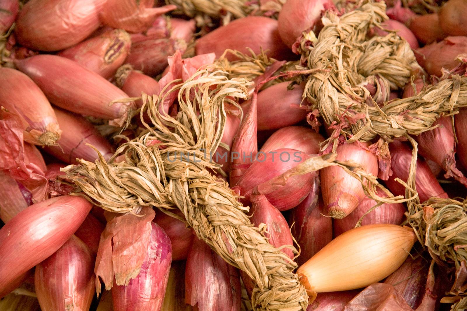 Red onions on market stall. Shallow focus.