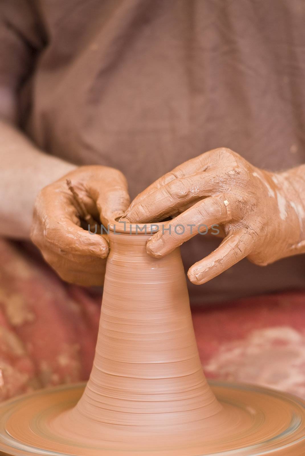 Potter working with clay.