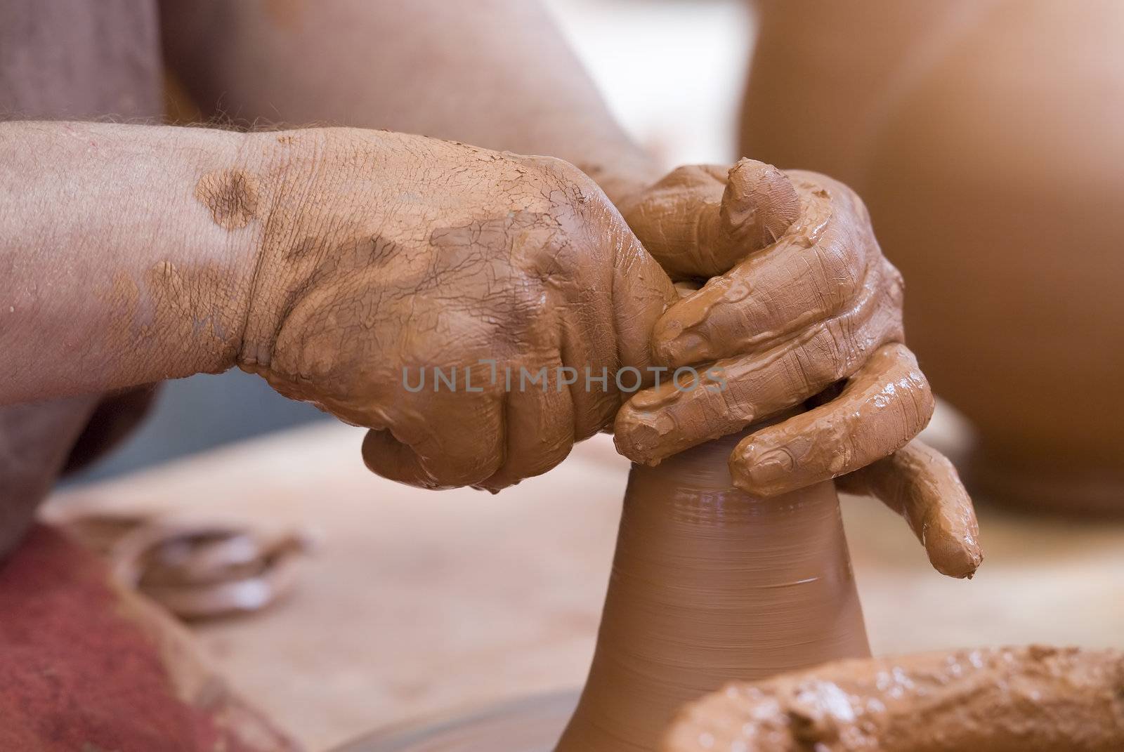 Potter working with clay.