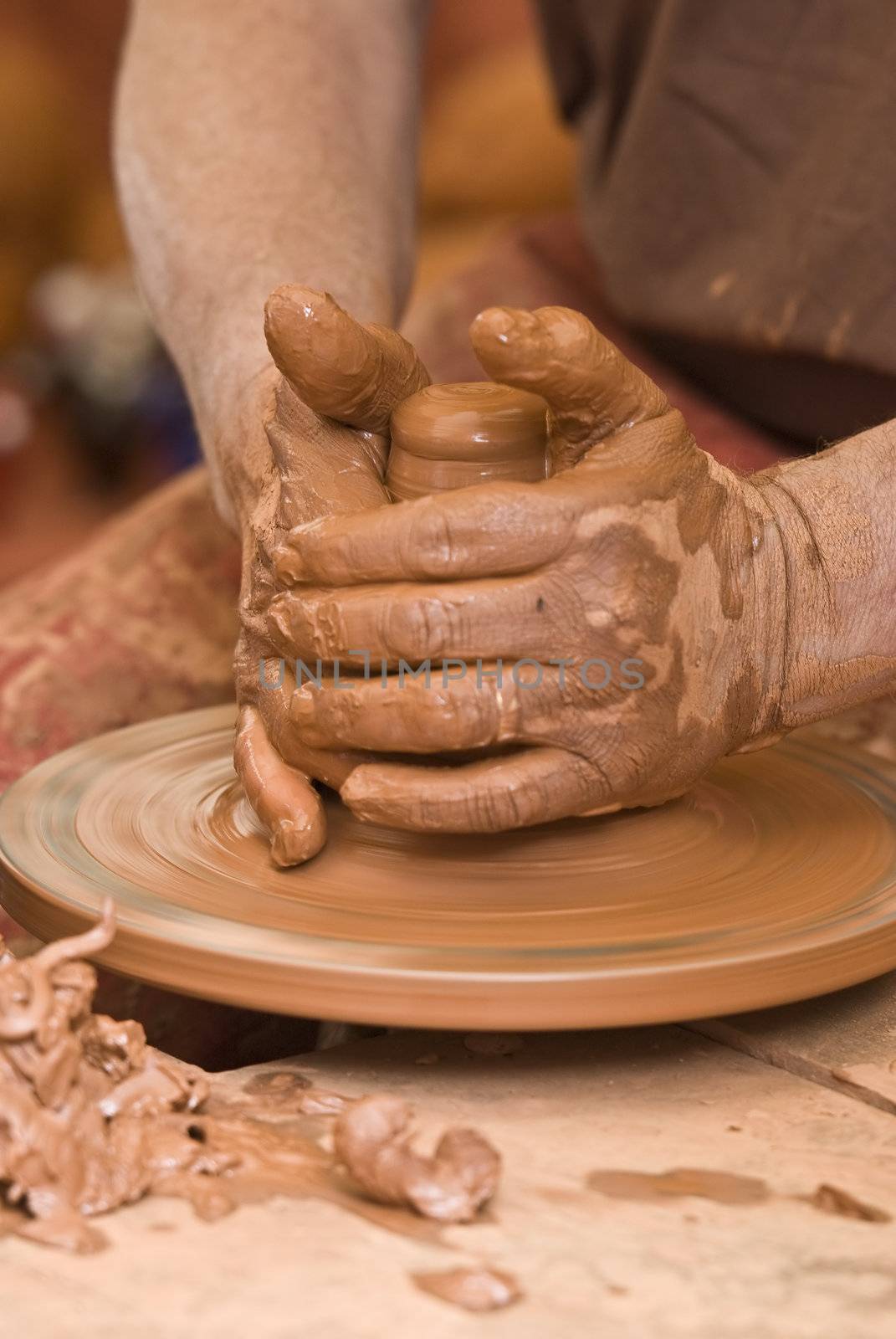 Potter working with clay.