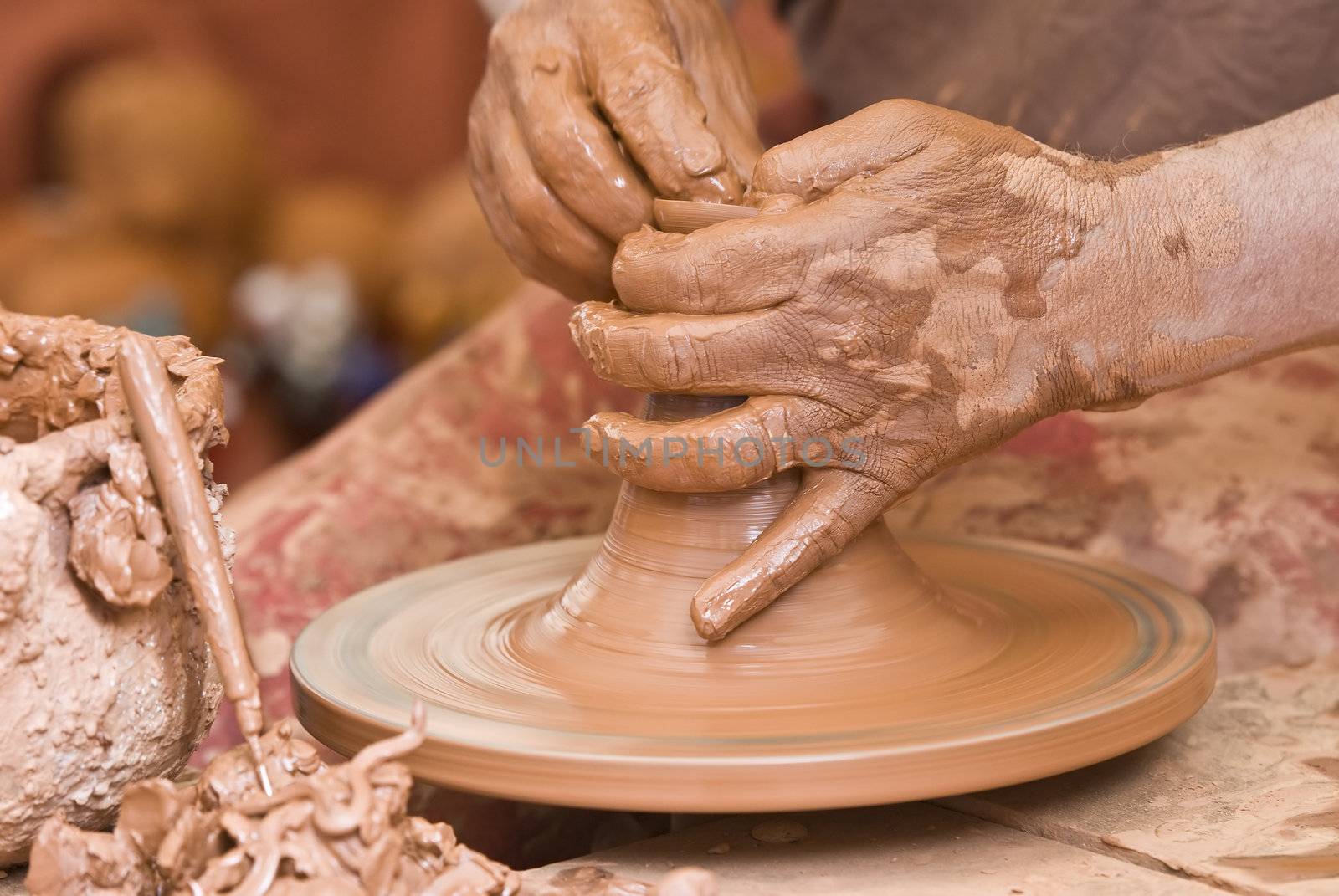 Potter working with clay.