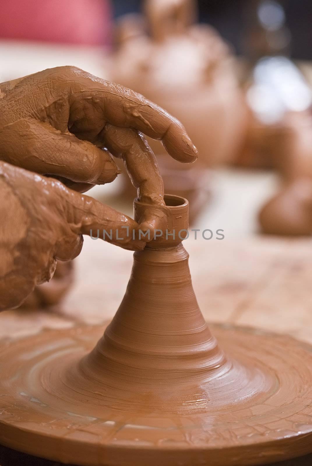 Potter working with clay.