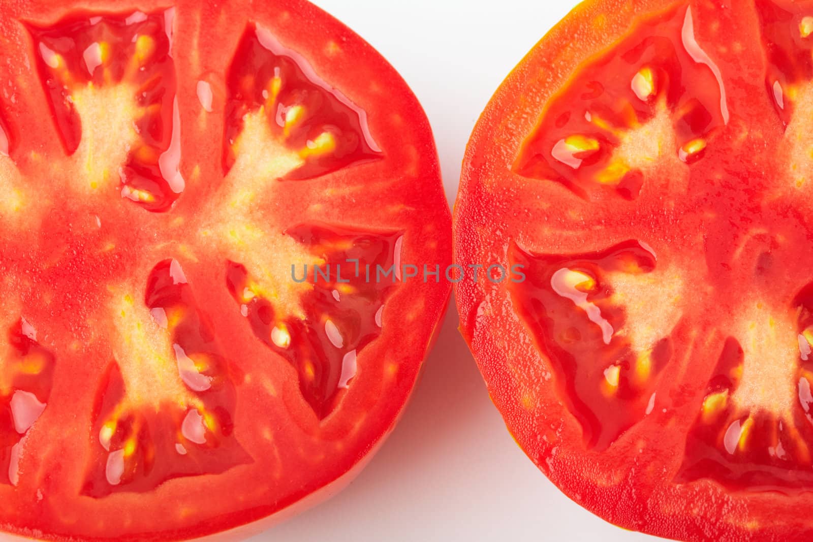 Two cutted tomatoes by romanshyshak