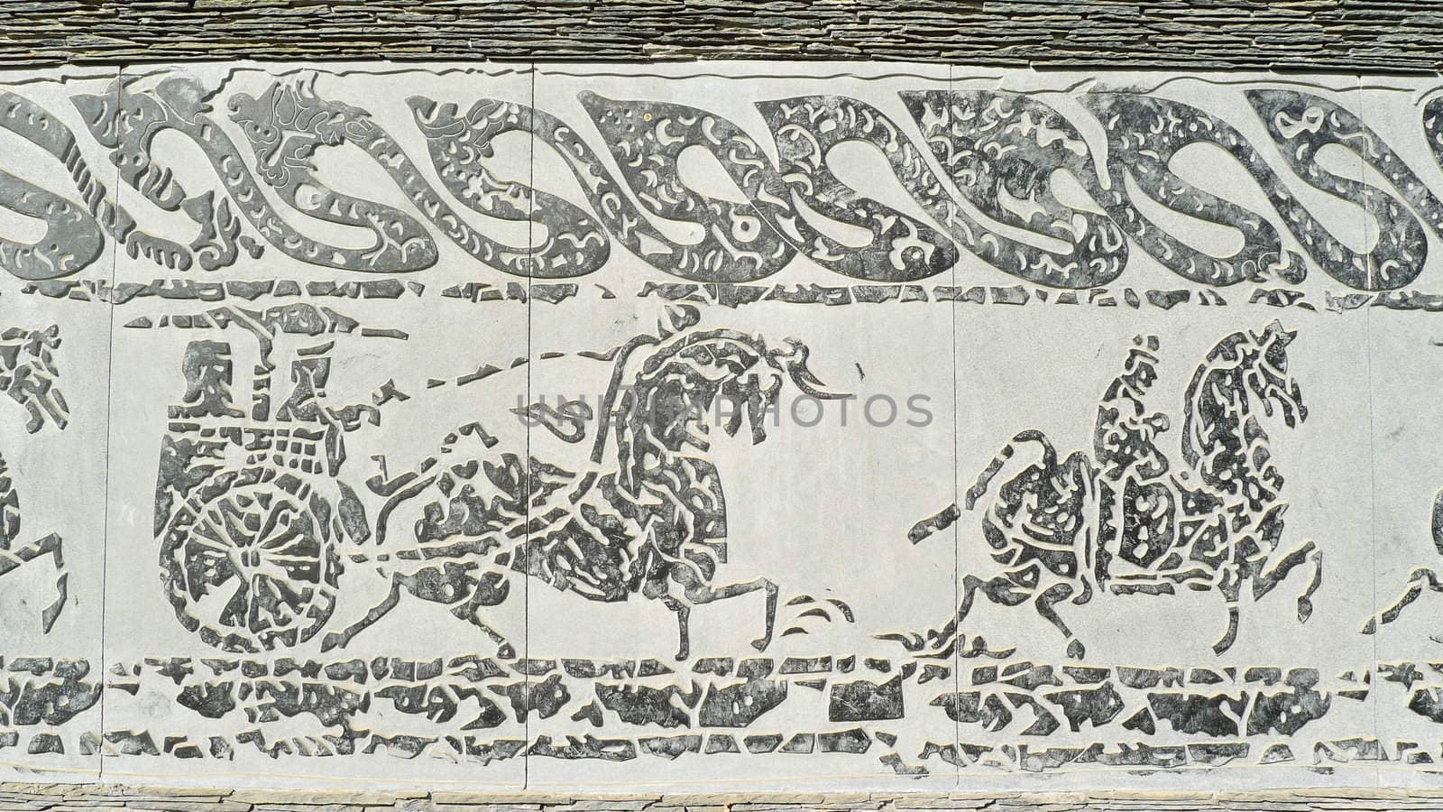 Chinese ancient rock art of vehicles and horses 