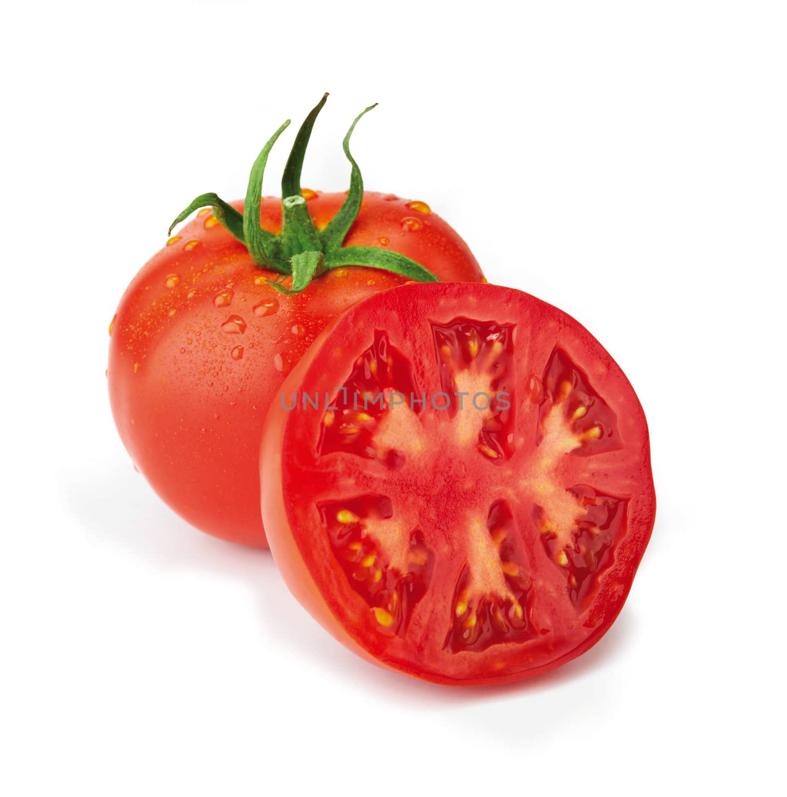 Fresh, washed tomato with half. The file includes a clipping path.  Professionally retouched high quality image. 