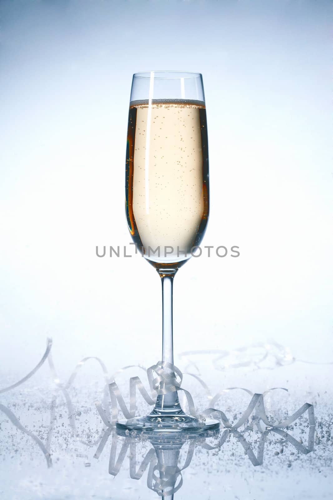 Glass of champagne with festive ribbons