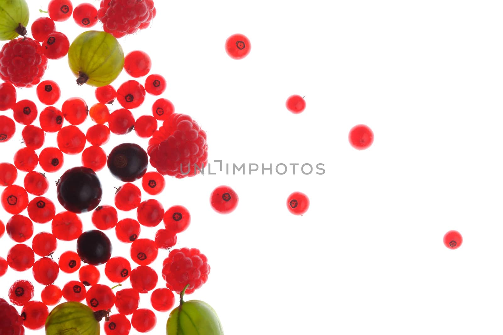 Spilled  mixed berries on white background