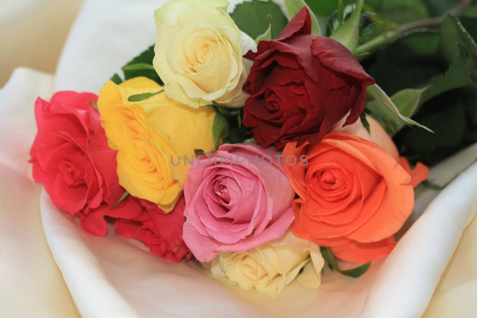 roses on white satin, mixed color bouquet