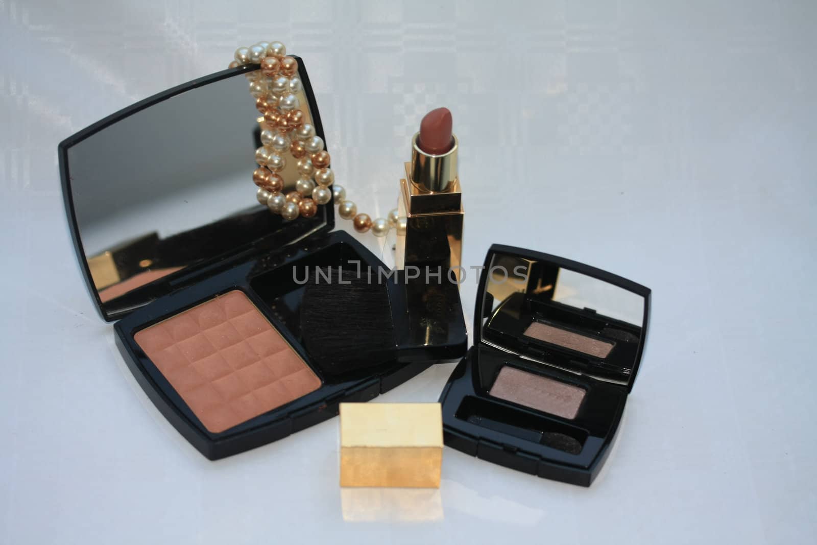 Luxury blusher, lipstick and an eyeshadow palet