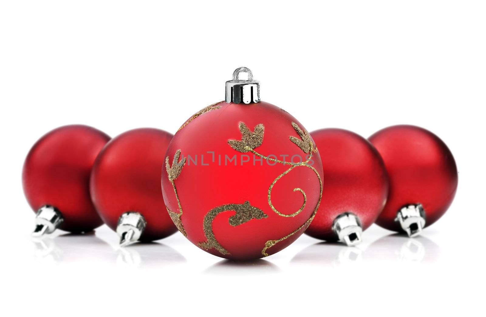 Red christmas baubles on white background with space for text