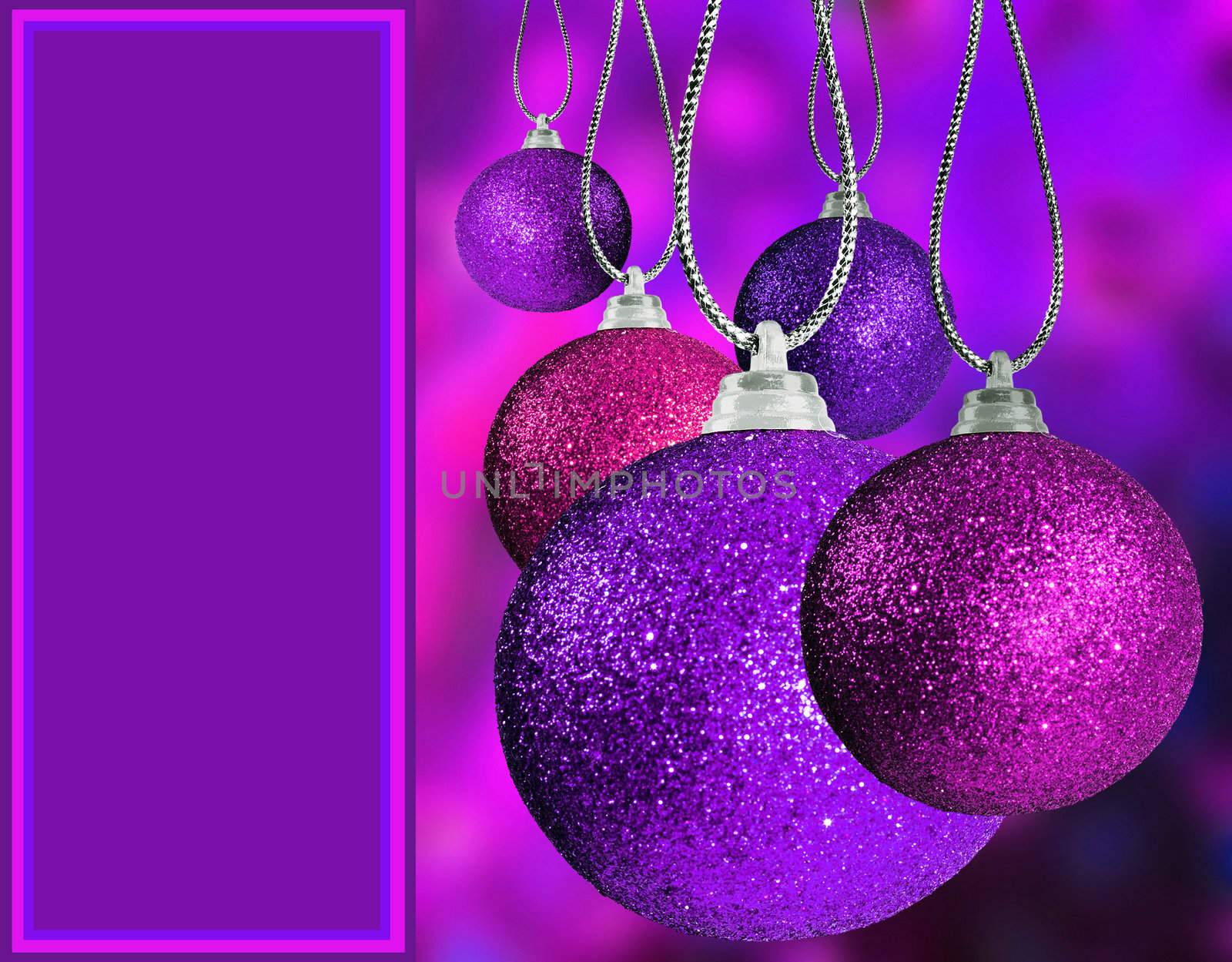 Close up of purple and pink christmas baulble balls in different sizes  hanging on strings