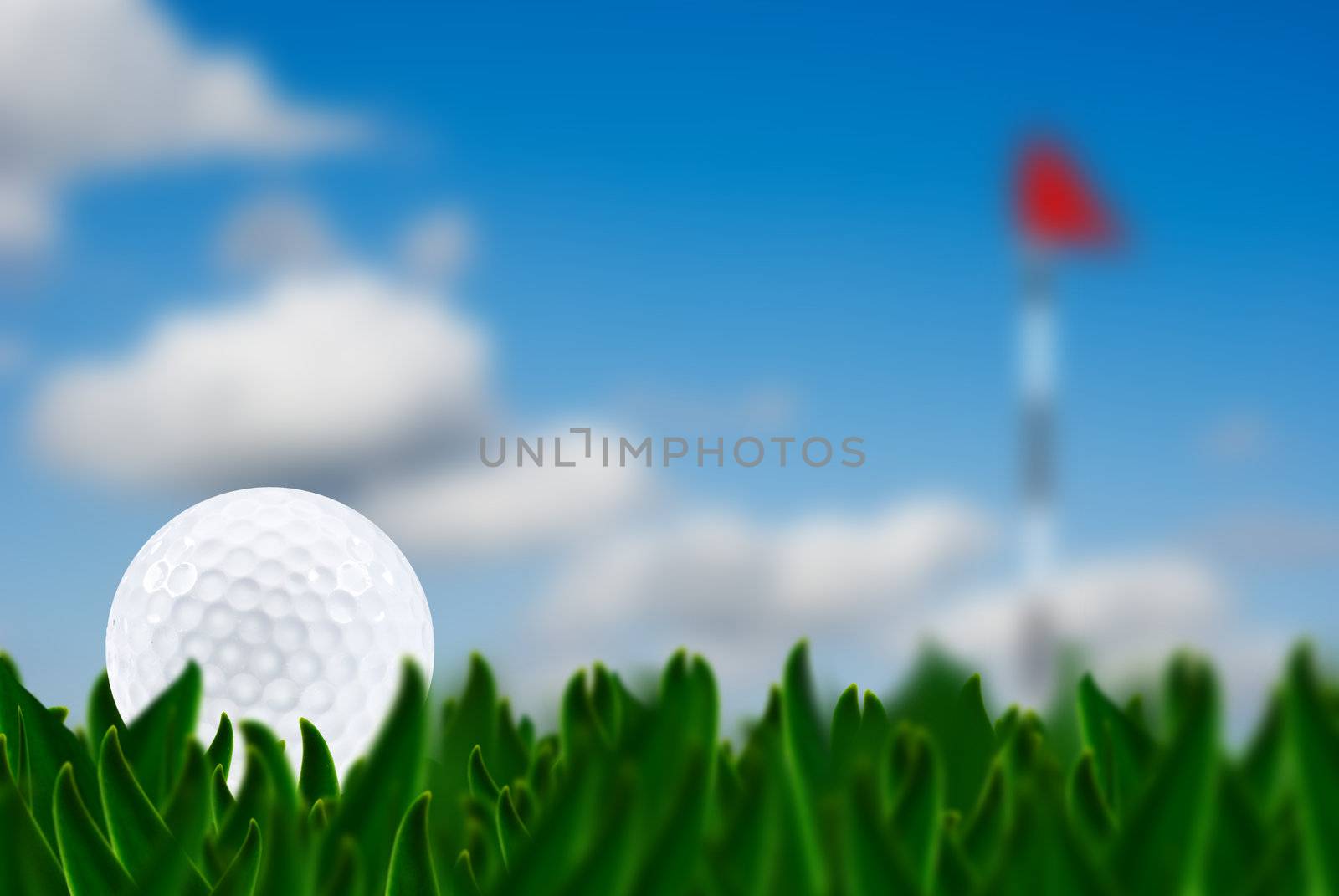 Golf ball on a golf course with the green in the background - very shallow depth of field by tish1