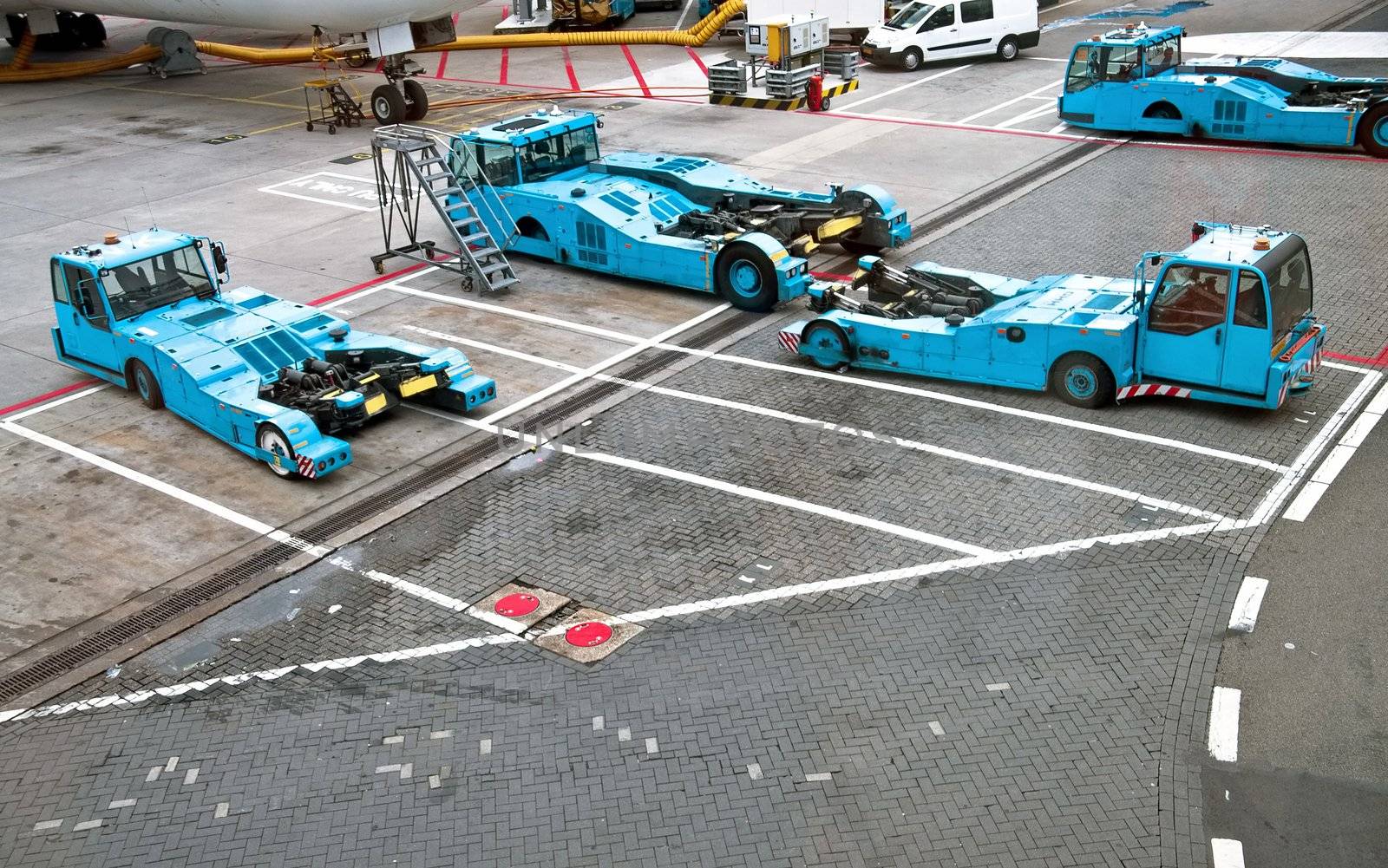 Azure Pushback tractors  stationed in airside landing of an airport