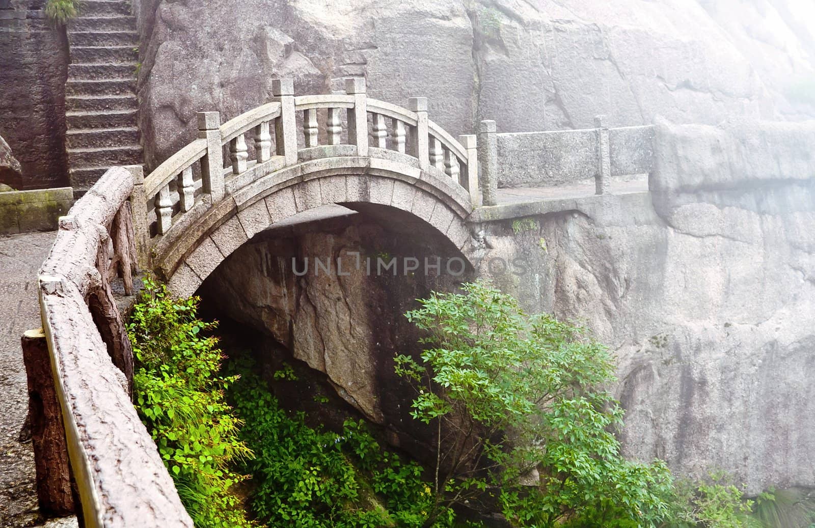 Foggy Stone bridge in Huangshan mountains, China