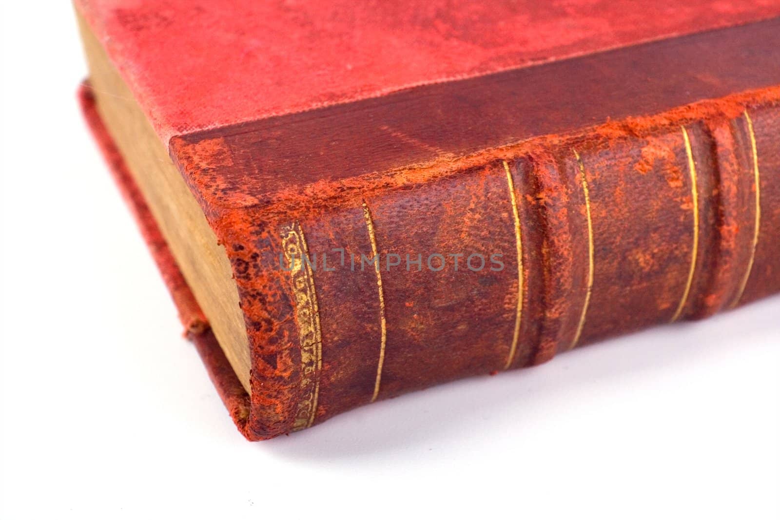 Old folio in dark red cover on white background. Book with ancient knowledge.