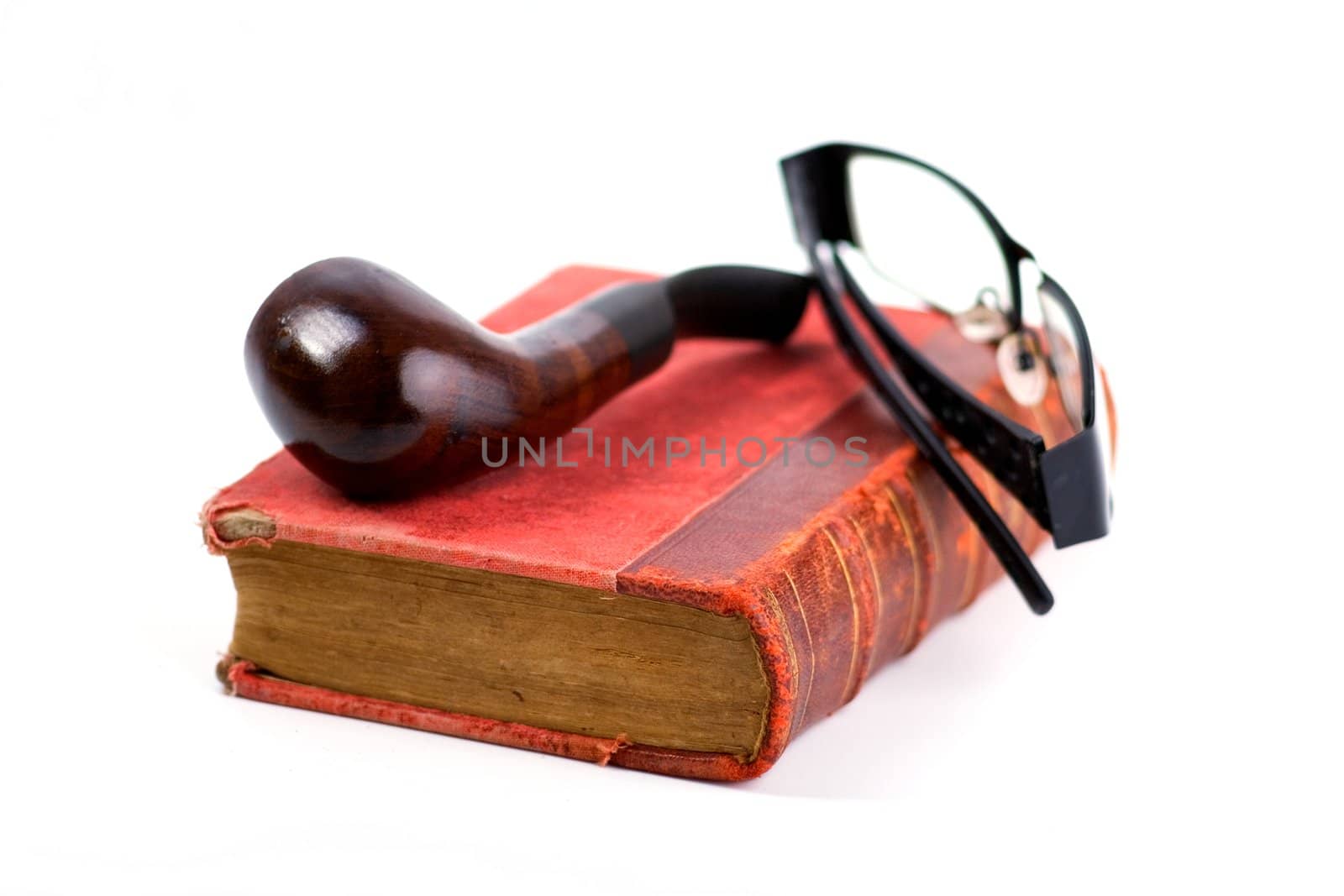 Old folio in dark red cover, pipe and black-rimmed glasses on white background. Book with ancient knowledge.