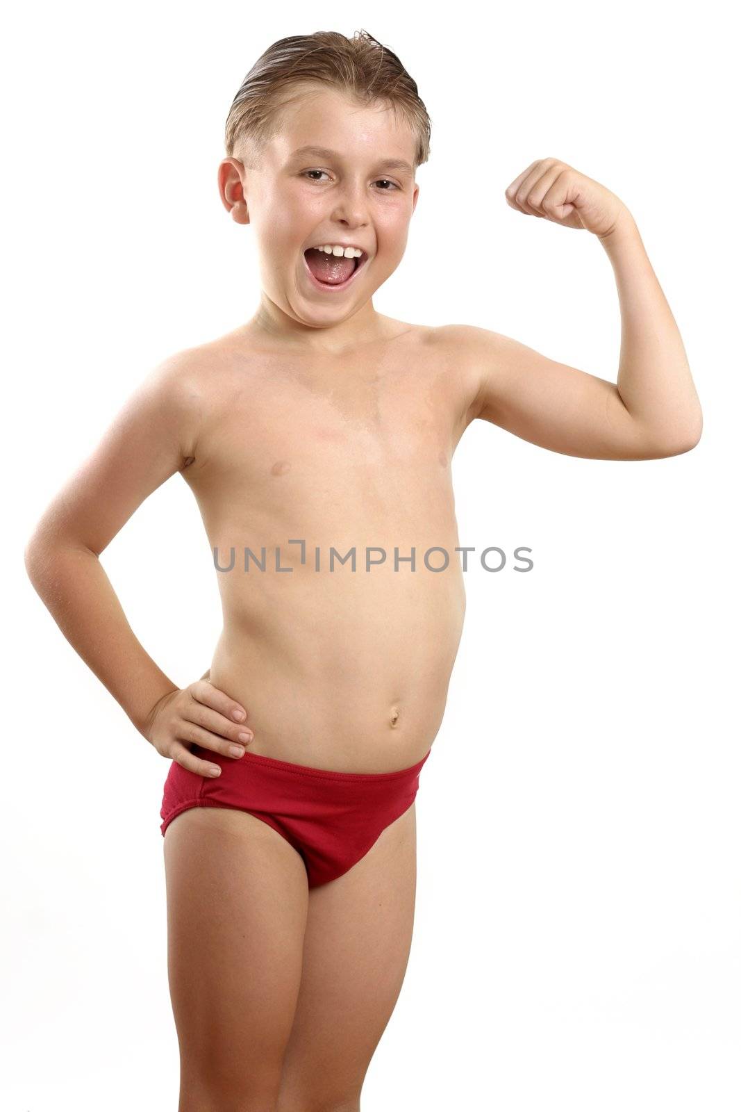 Child flexes his arm muscles