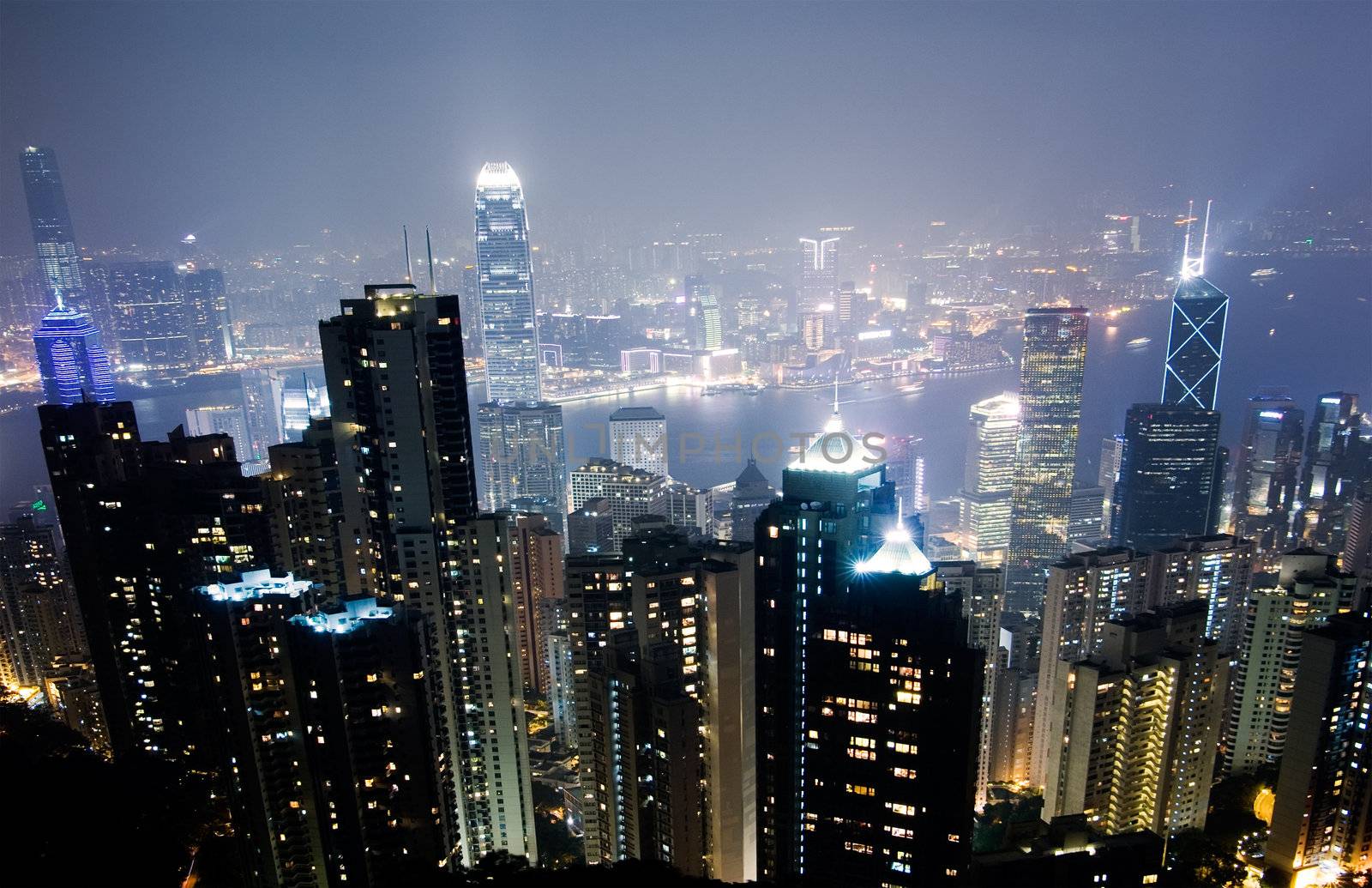 Skyline in City with famous skyscraper scene in night in Hong Kong, Asia.