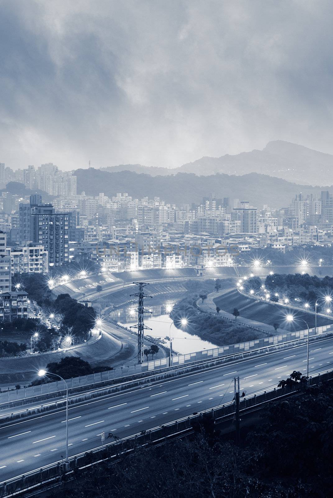 Highway over river in bad weather in the morning.