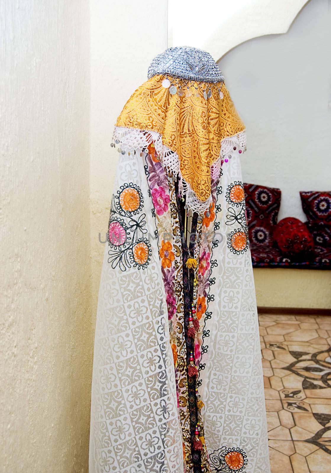 Traditional Uzbek woman's garment on rack