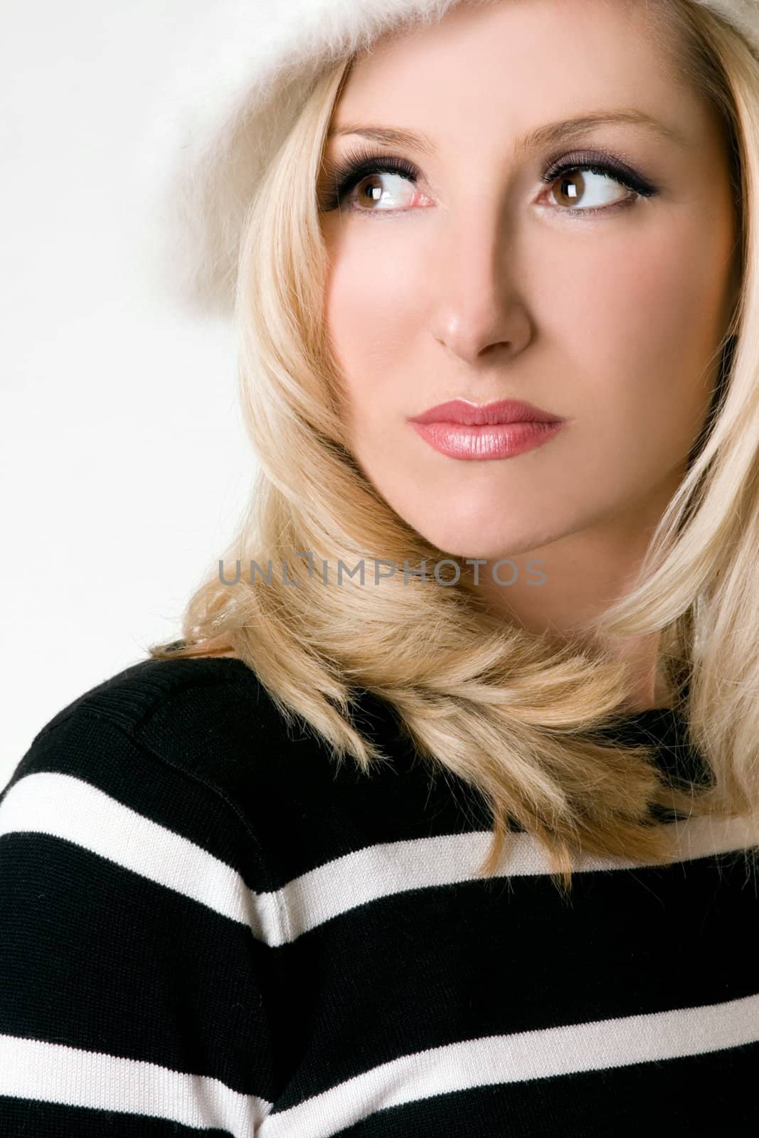 Winter styled woman looking over shoulder.