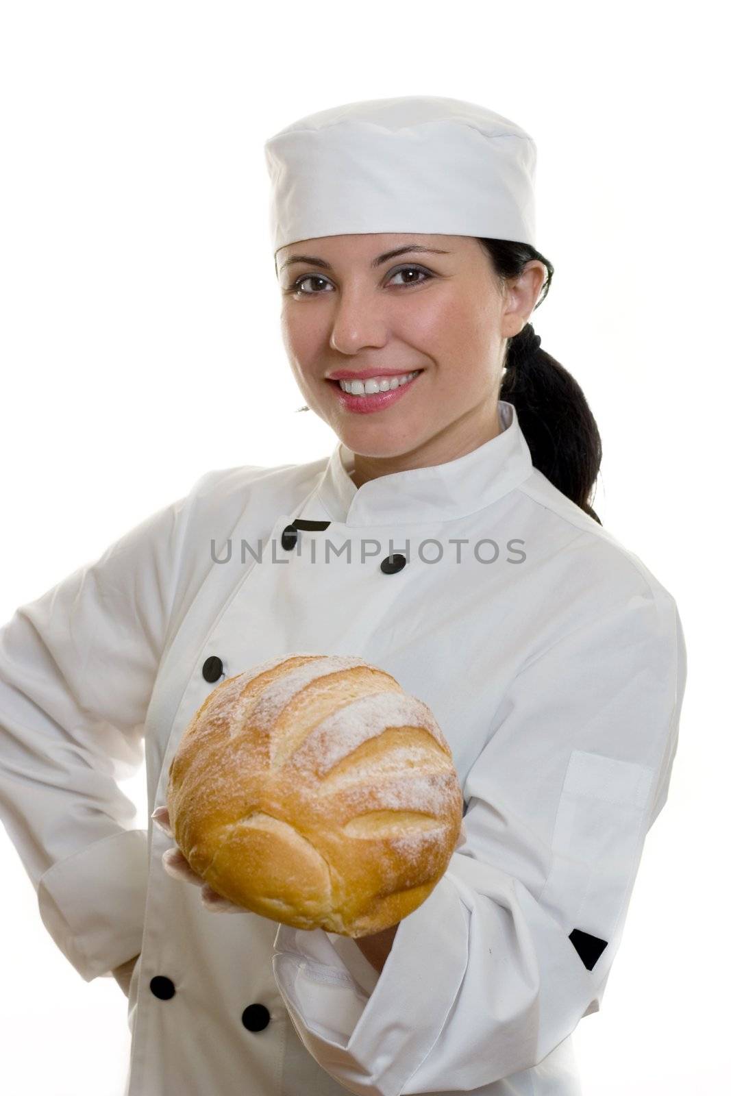 A smiling chef holding a loaf of bread.