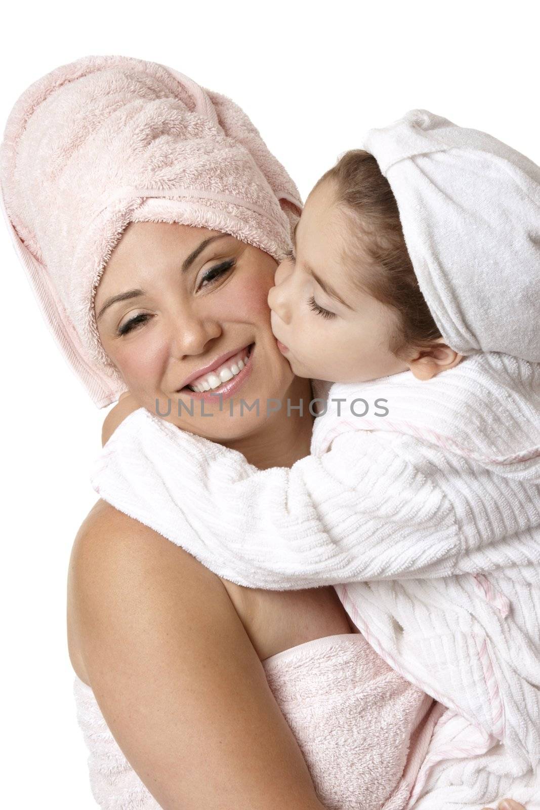 Smiling mother and daughter at bathtime