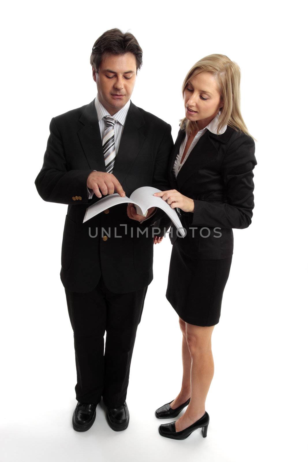 Business people reading contract or report by lovleah