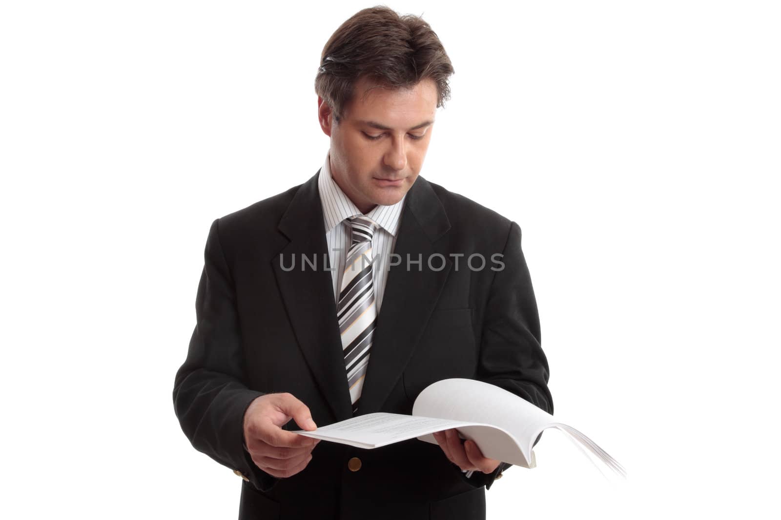 Busienssman reading a report or other document.