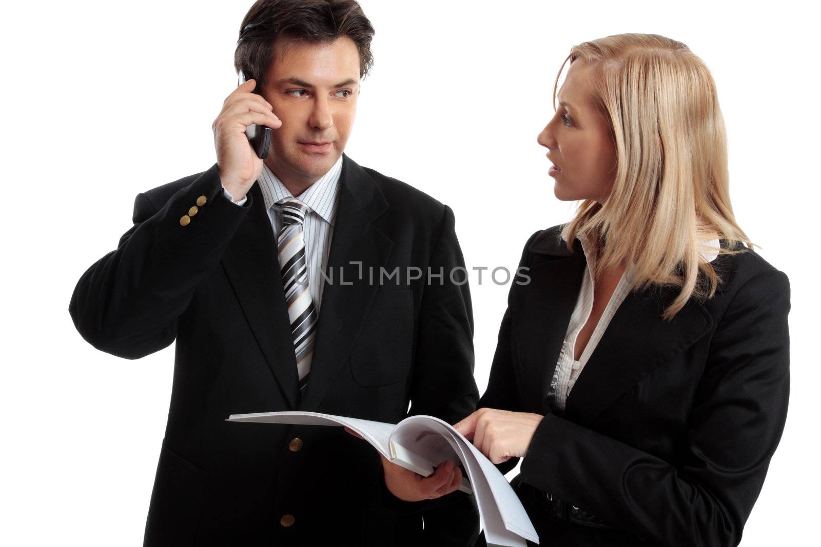 Business people discuss or make enquires or decision regarding a report, contract or other document.