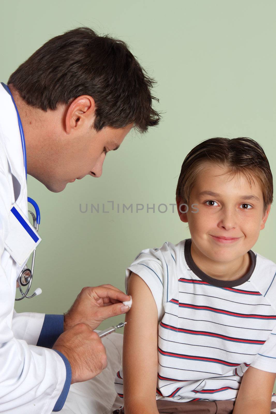 Doctor injecting child vaccine by lovleah