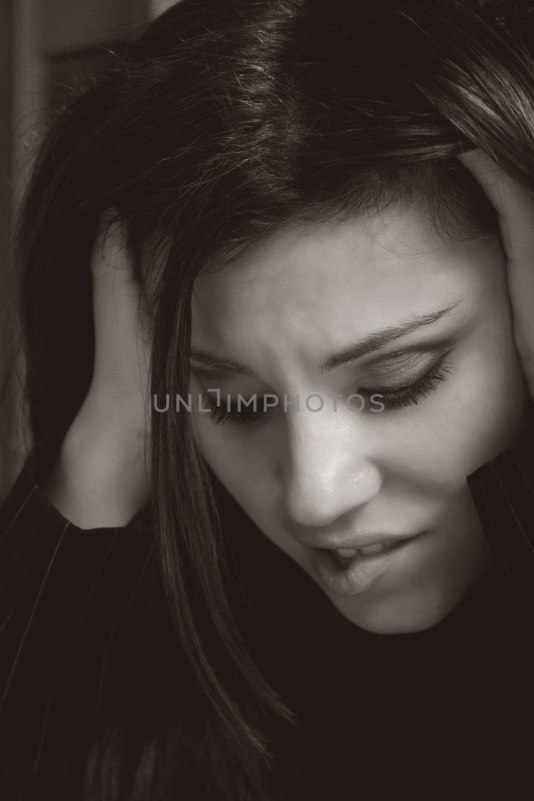 A woman shows angst, stress, worry,apprehension, overwork, business or financial woes.
