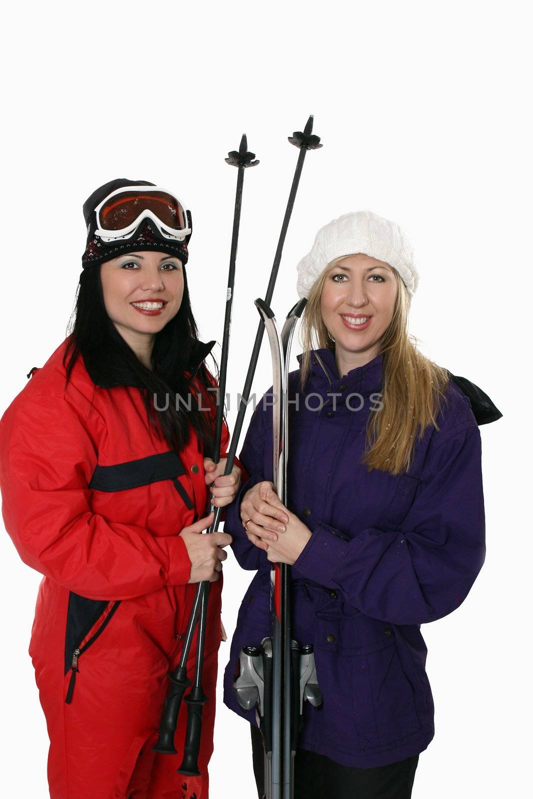Two women ready to go skiing in winter.