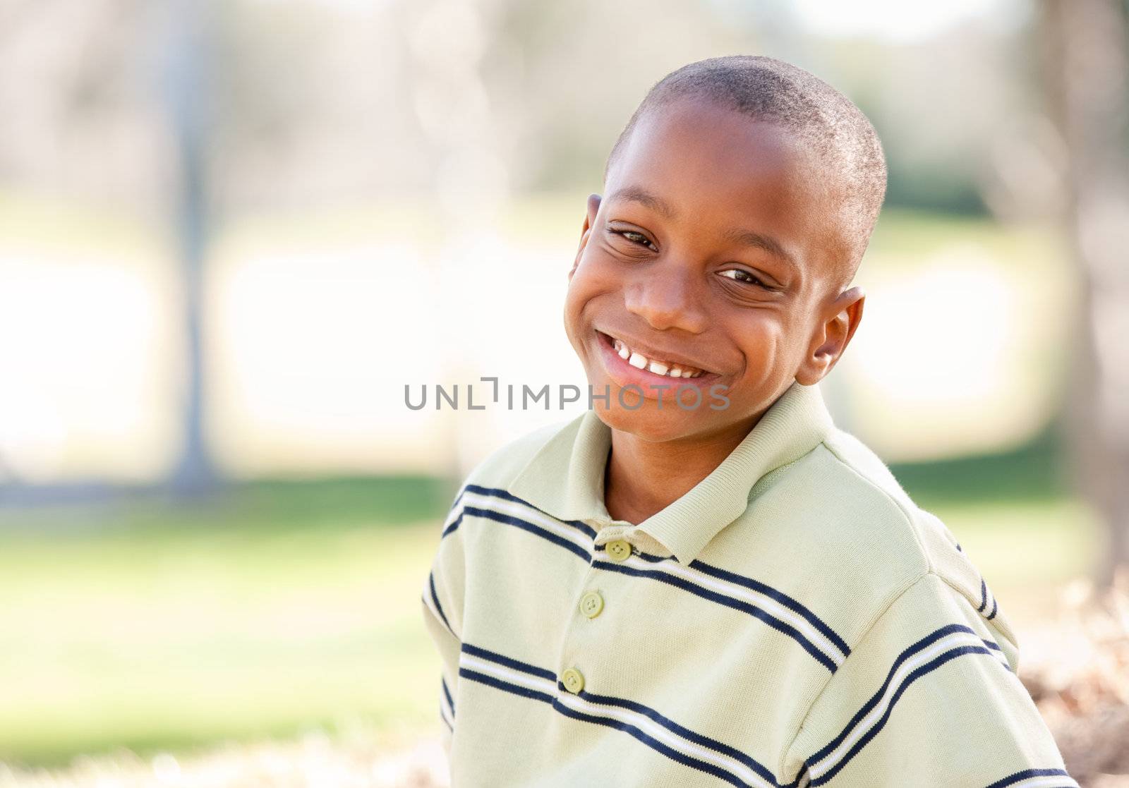 Happy Young African American Boy in the Park.