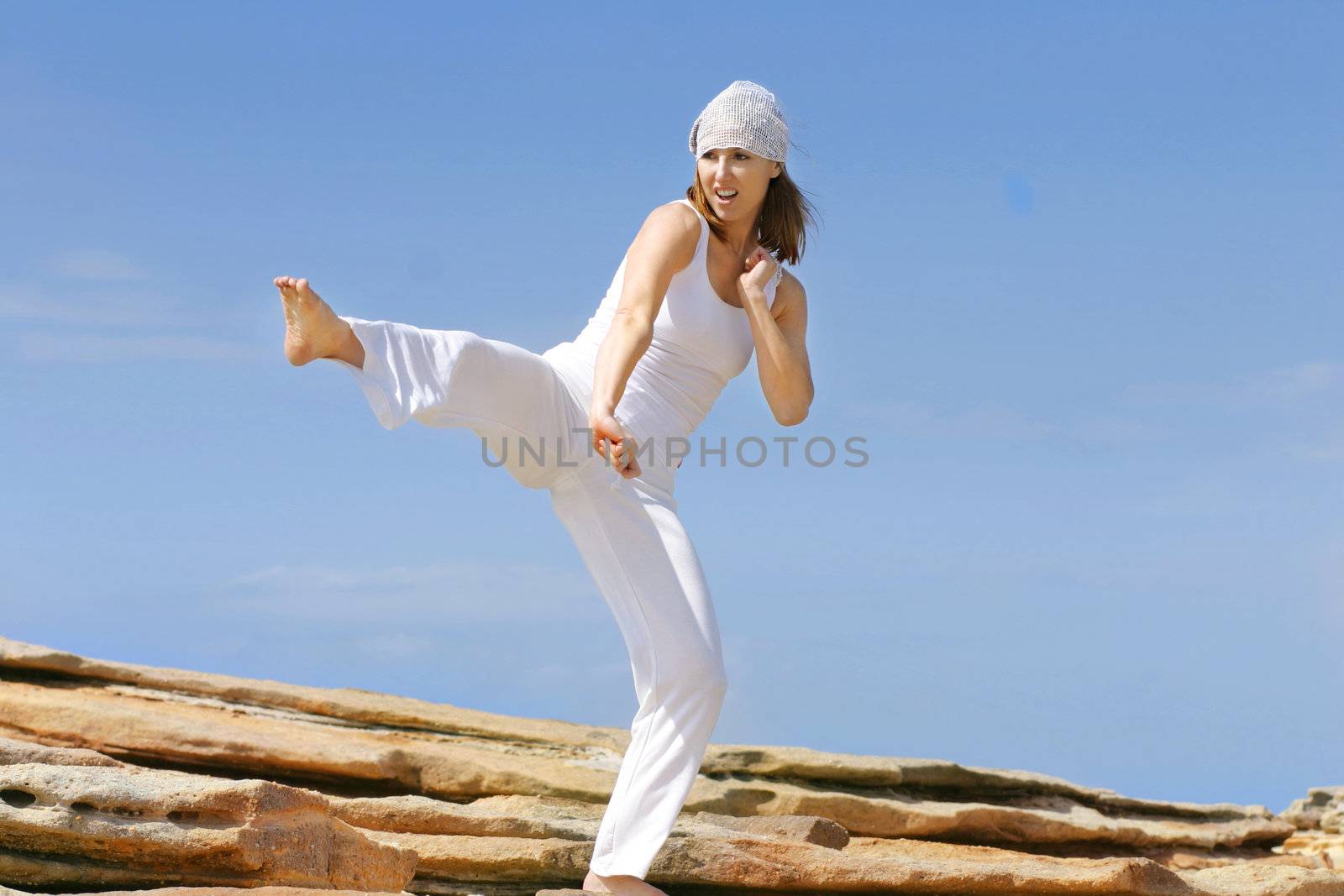 Large high karate kick.  
Great aerobic, cardio workout and self defense.

 kickboxing, athletic, martial art, protection, self defence